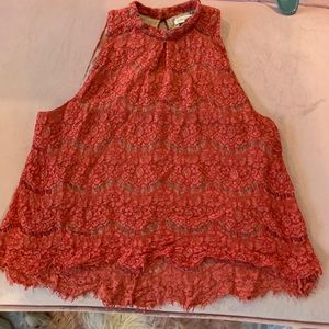 Bright orange sleeveless blouse